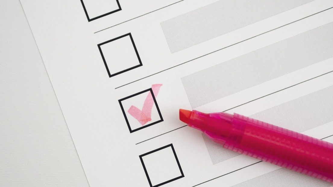 checklist-fp Closeup of checklist with checked box and pink marker illustrates blog "Your Roofing Maintenance Checklist"