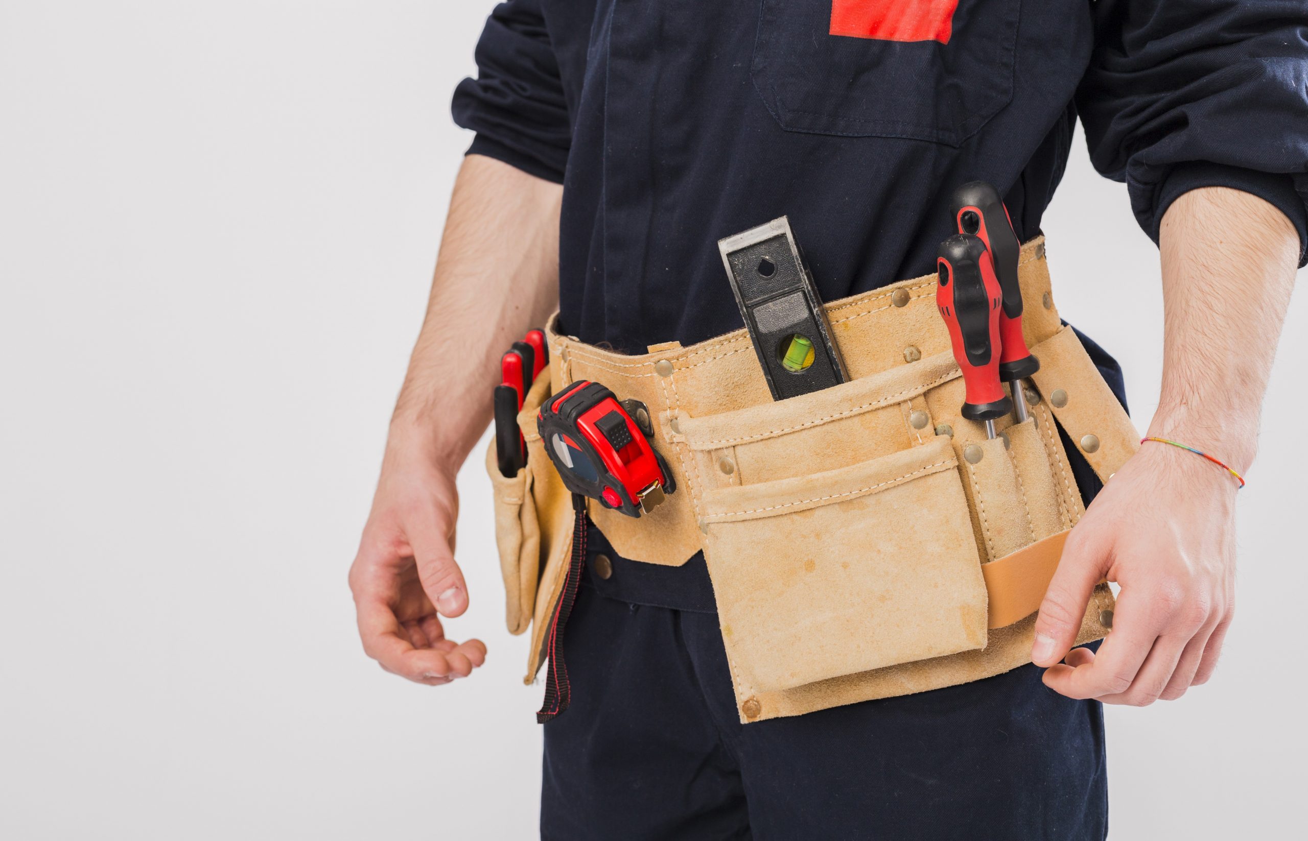 Handyman with tool belt illustrates blog "Can You Repair Your Roof Yourself?"