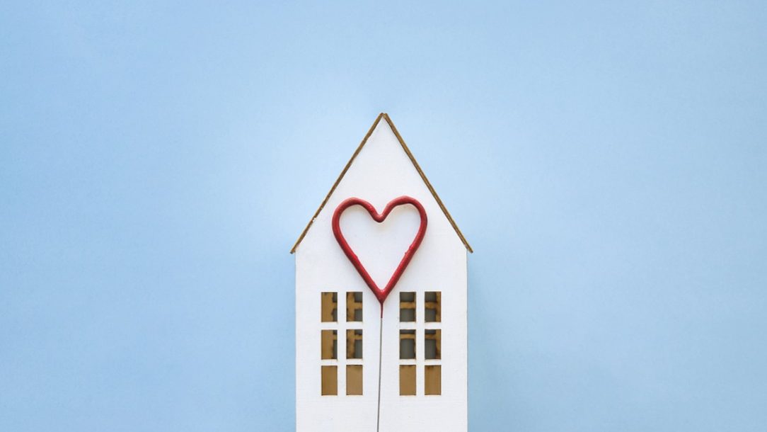 Toy house with heart under its roof.