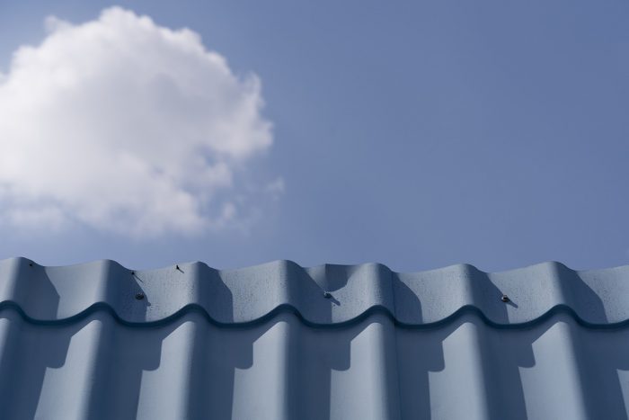 Roof against sky with cloud.