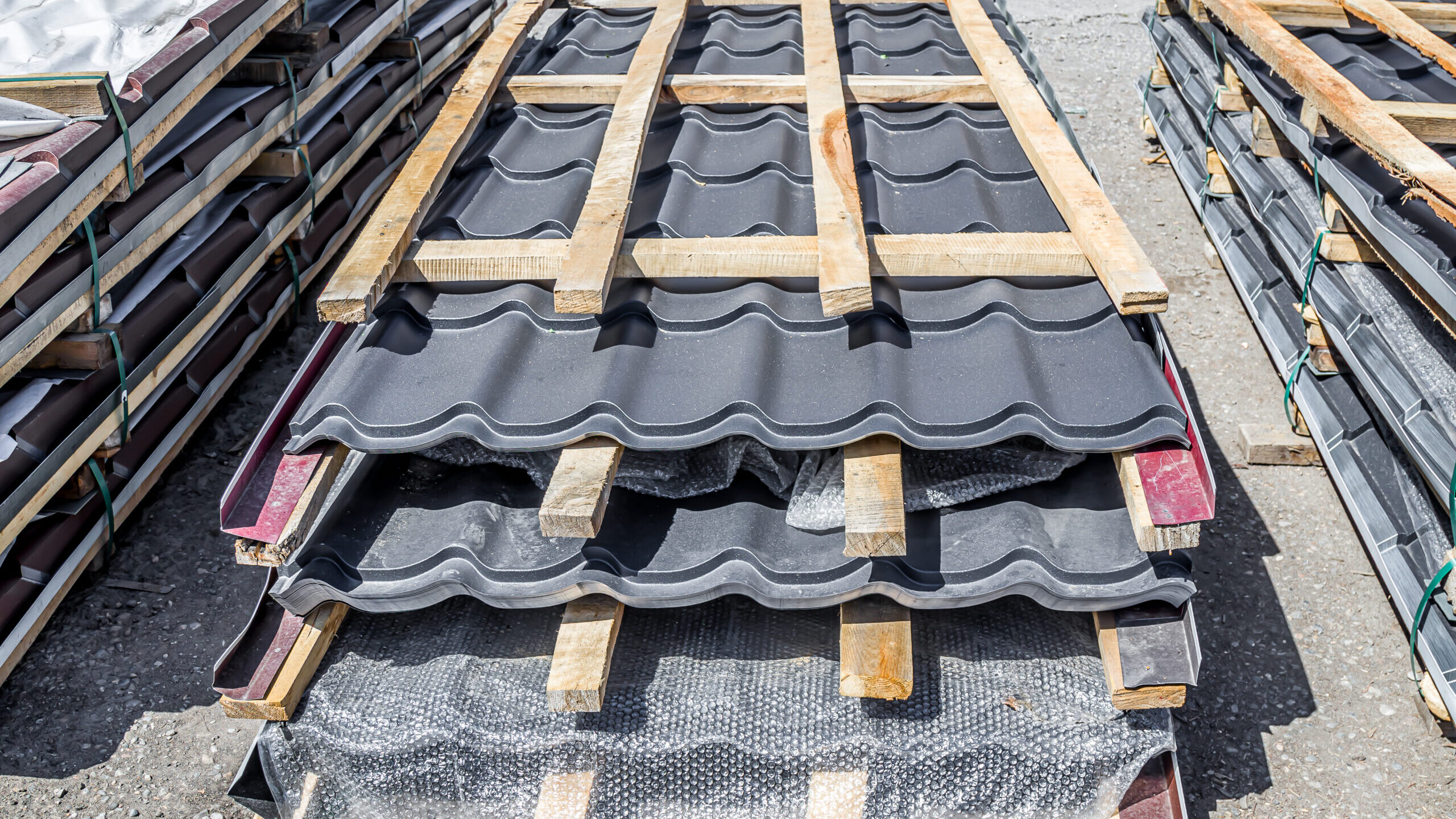 multicolored metal decking, a sample of the product advertising.Metal roofing for sale