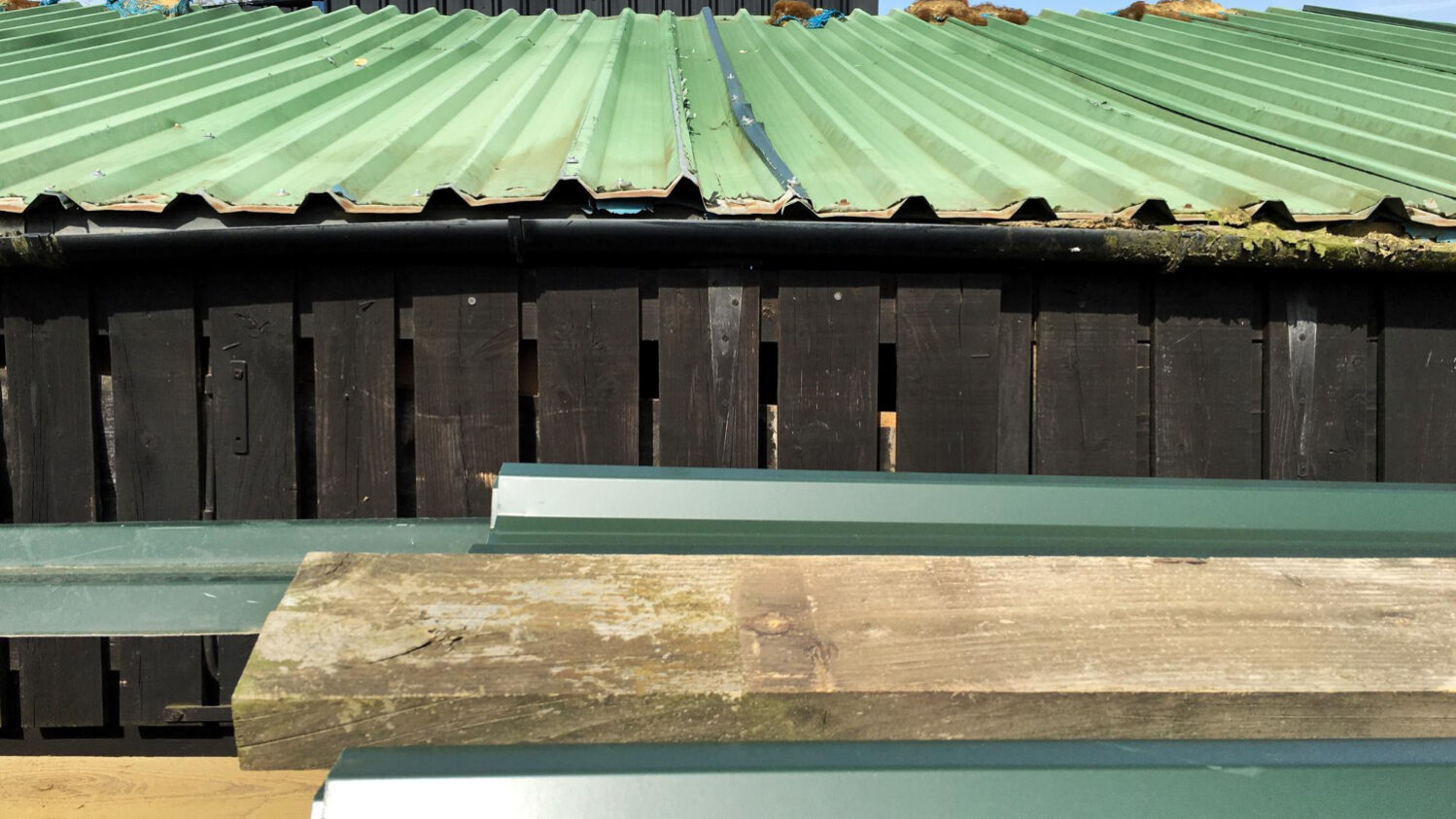 2631 Roof decking replacement showing sagging roofline