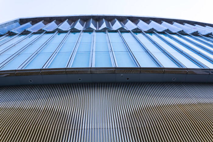 Contractor applying reflective coating on an energy-efficient roof in California