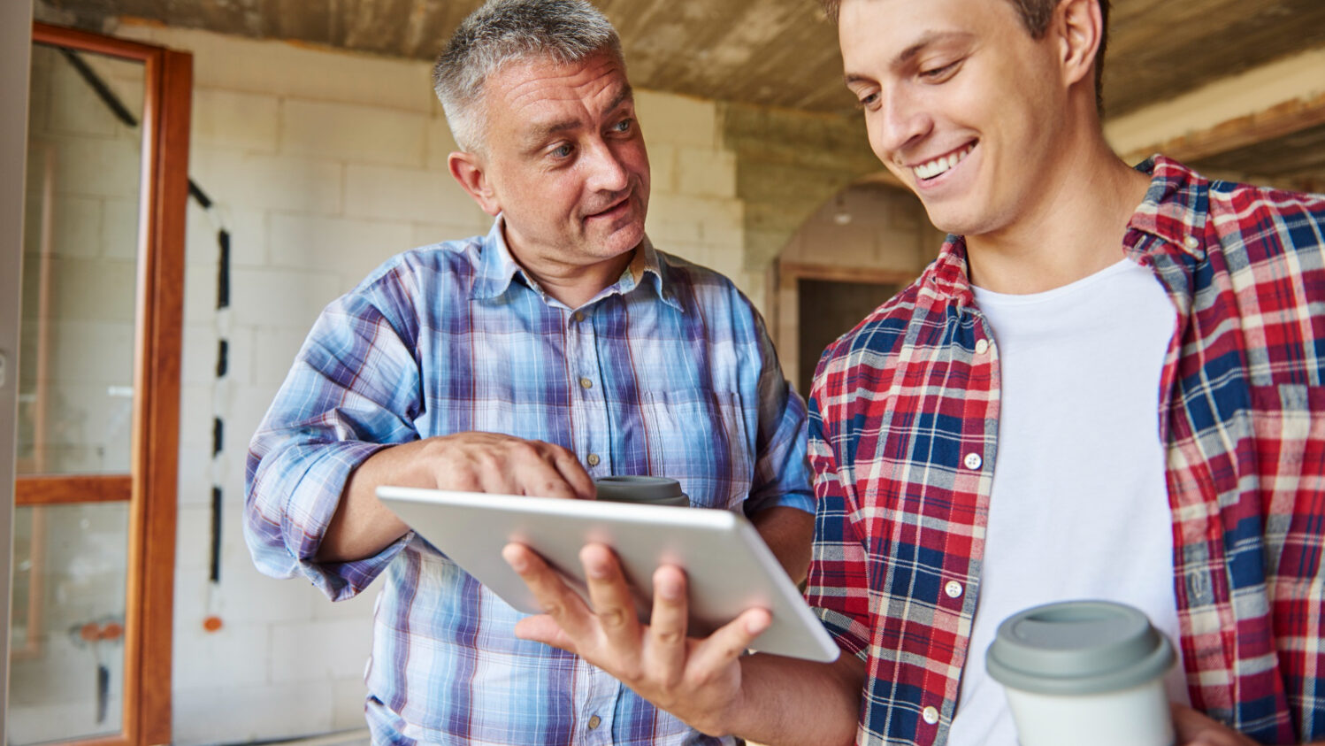 Homeowner discussing roofing project with licensed contractor in California
