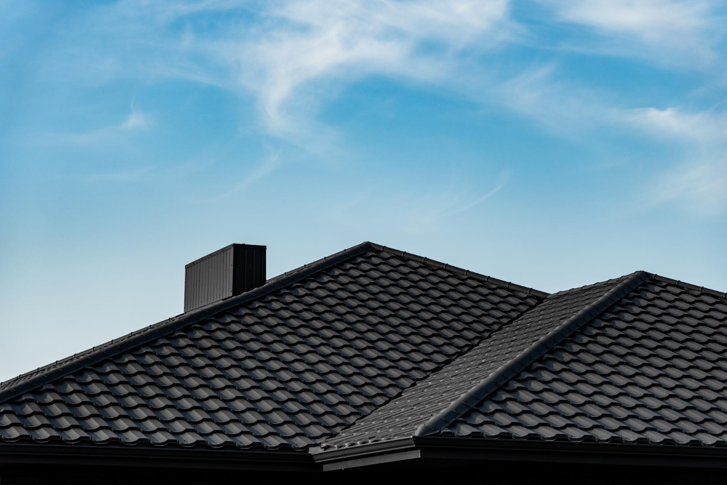 2298 Cool roof coatings on a California home roof reflecting sunlight