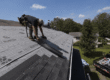 Roof insulation and underlayment installation on a residential home roof