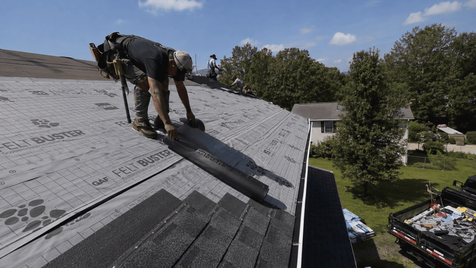 Roof insulation and underlayment installation on a residential home roof