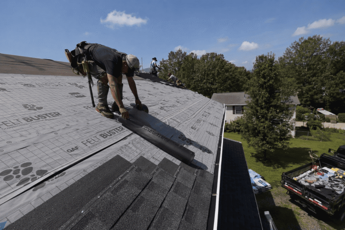 Roof insulation and underlayment installation on a residential home roof