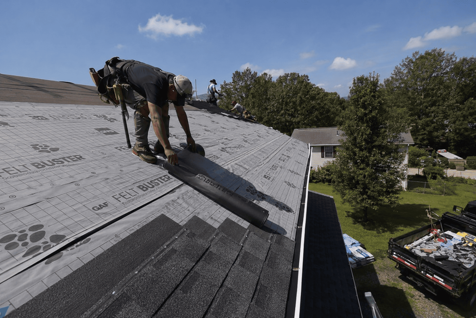 Roof insulation and underlayment installation on a residential home roof