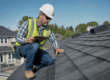 Contractor performing preventative roof maintenance on a residential roof