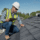 Contractor performing preventative roof maintenance on a residential roof